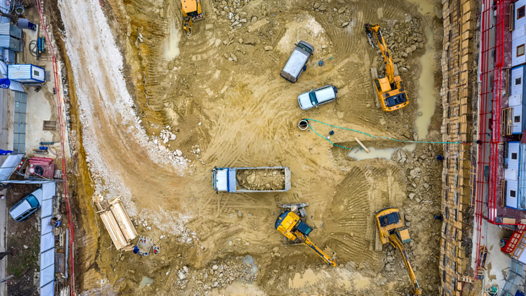 Aerial view of UK construction site showing equipment, vehicles, and site welfare facilities layout