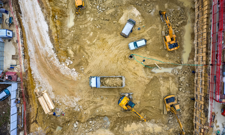 Aerial view of UK construction site showing equipment, vehicles, and site welfare facilities layout